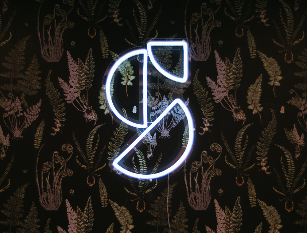 Shift Logo as a white neon sign.